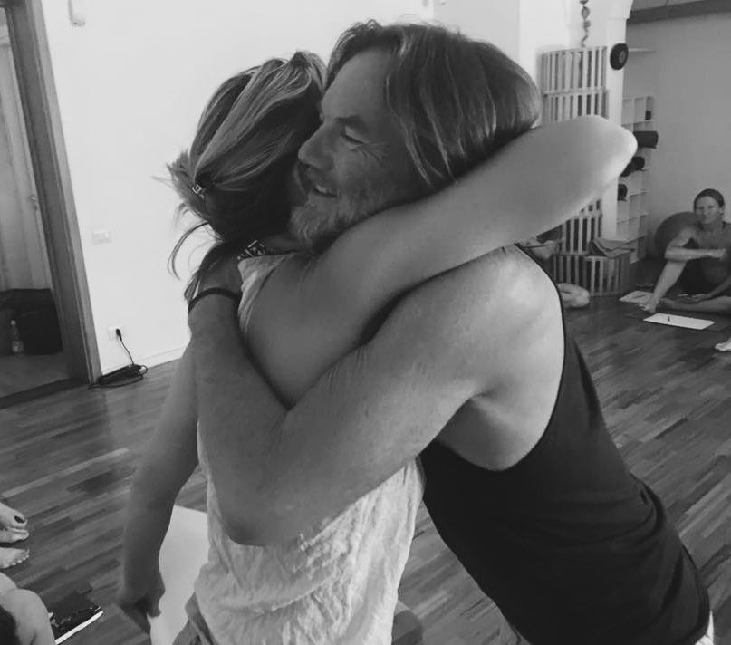 Kat Jennings hugging her teacher John Scott in Italy