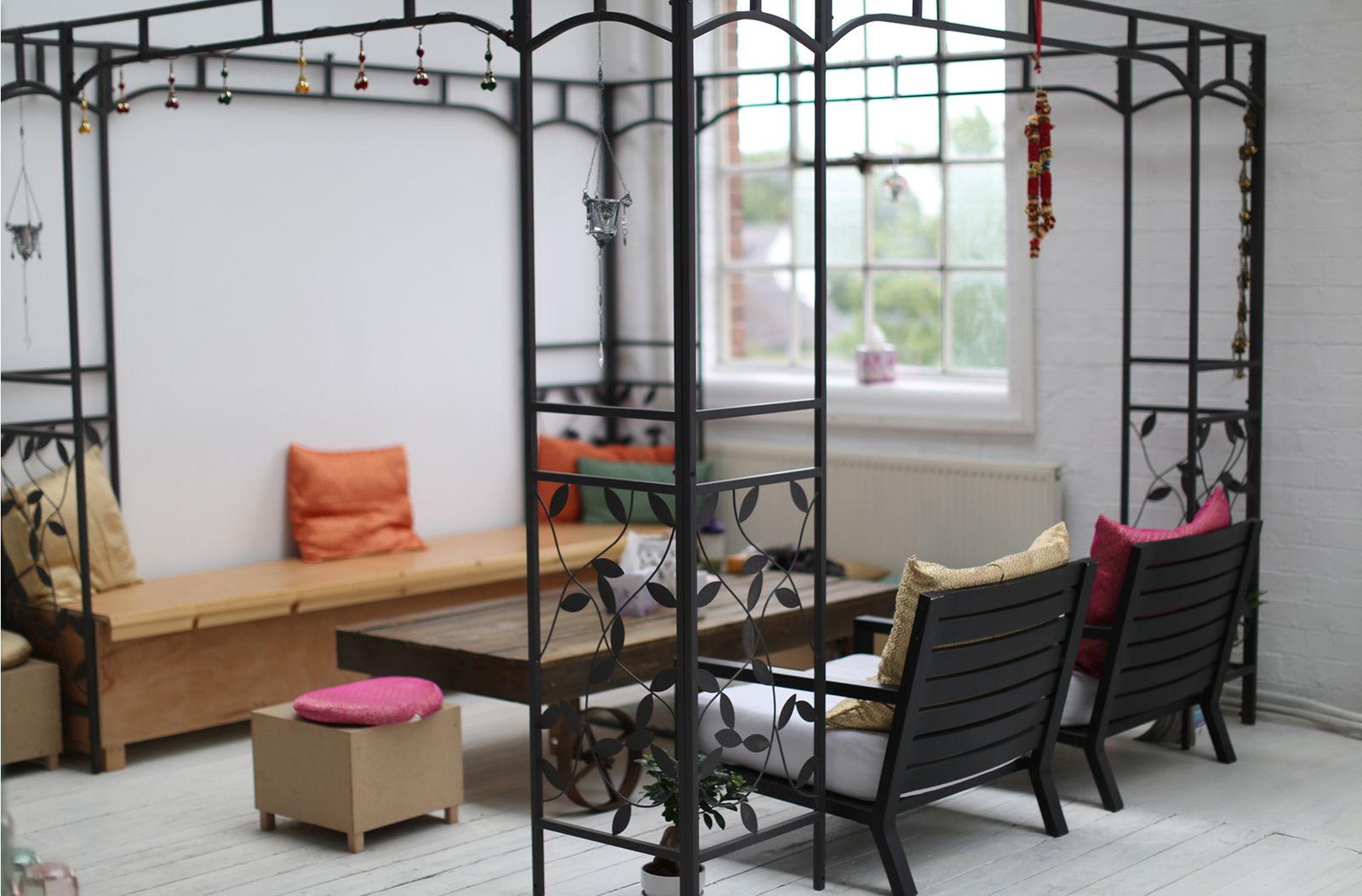 The lounge at The Yoga Loft, with sofas by the big arched window